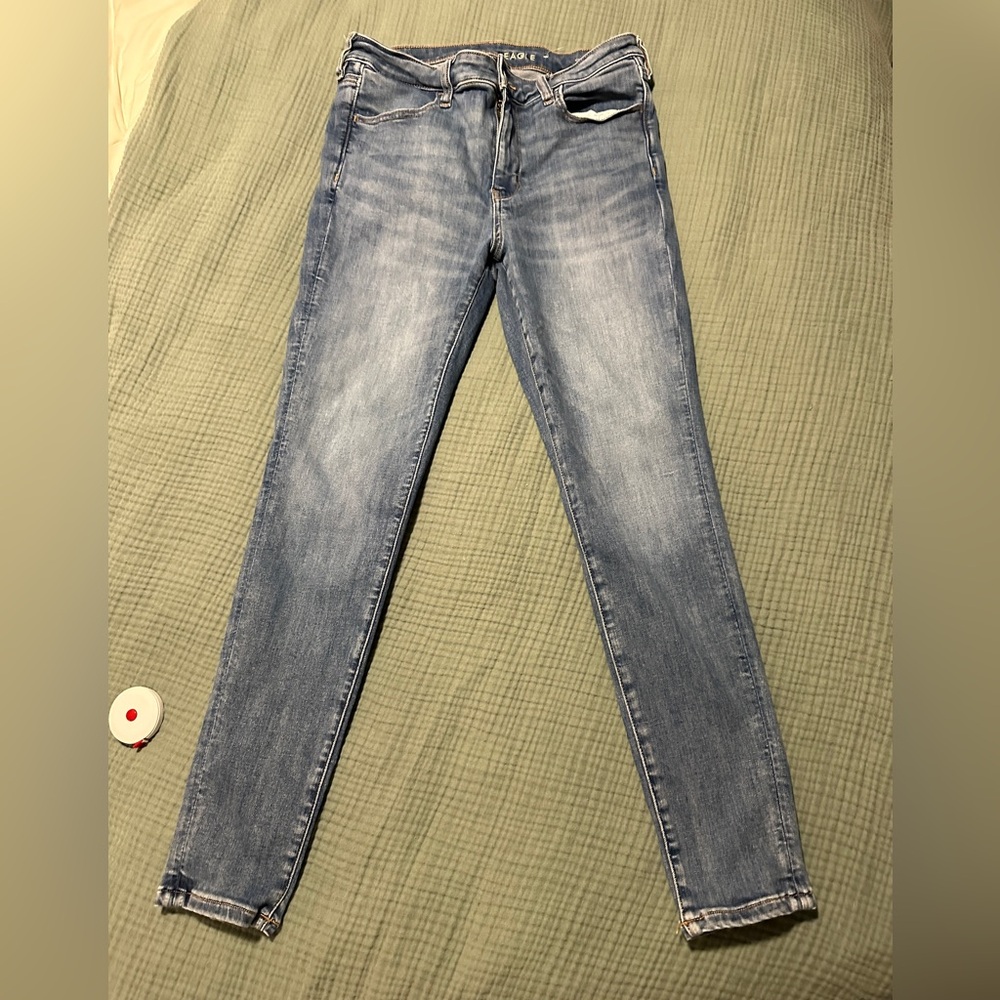 Women’s American Eagle super stretch regular length jeans, medium wash, size 12.